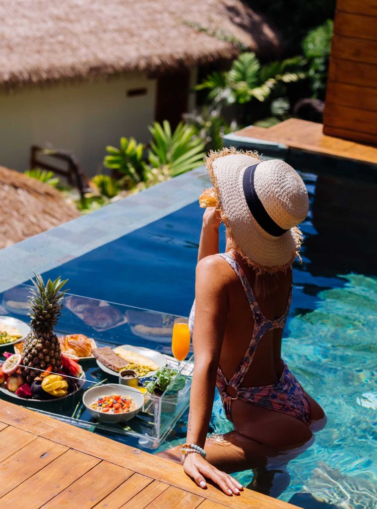 woman-in-bikini-and-straw-hat-with-floating.jpg